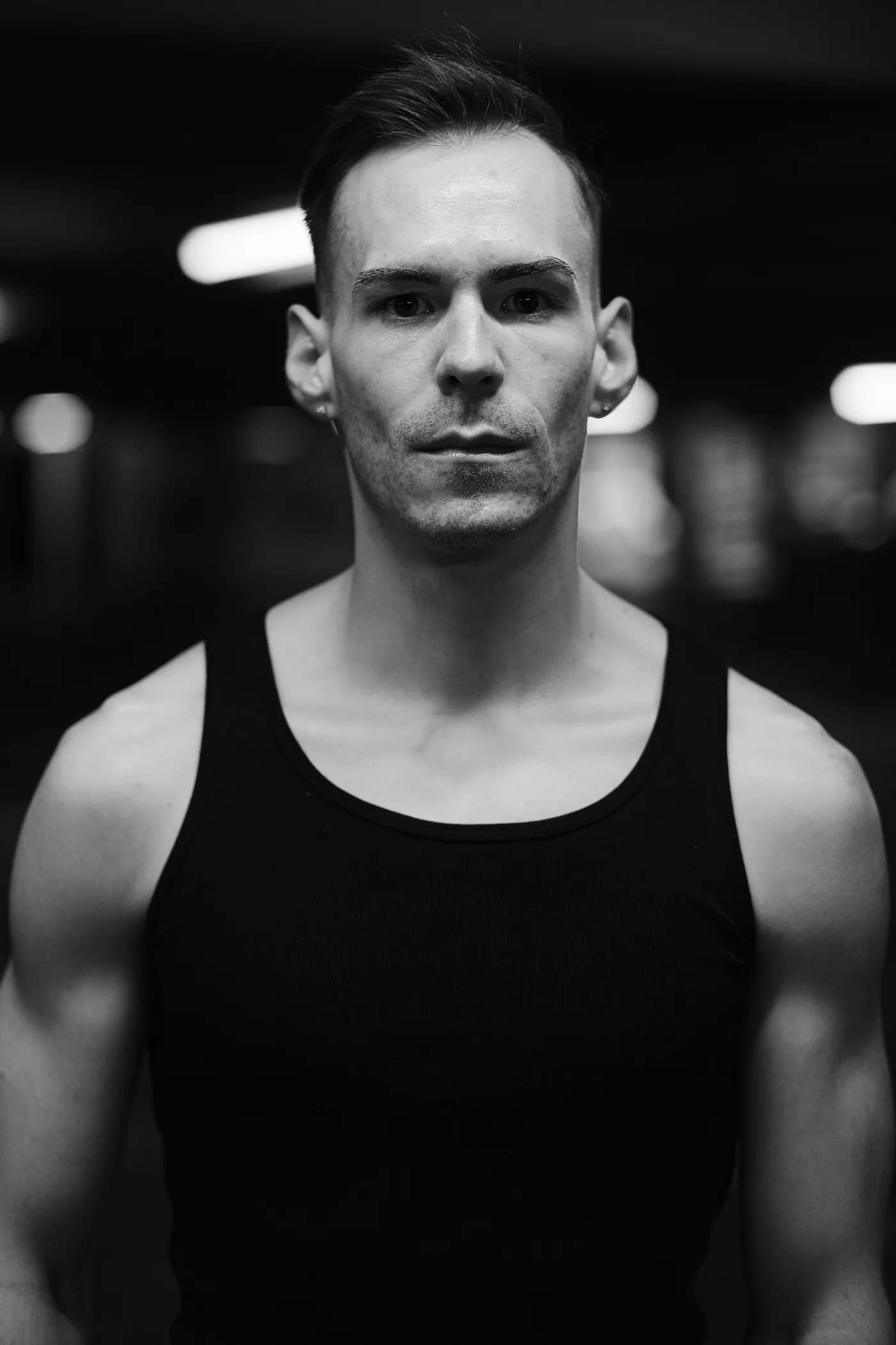 István in a moody, high-contrast black and white portrait