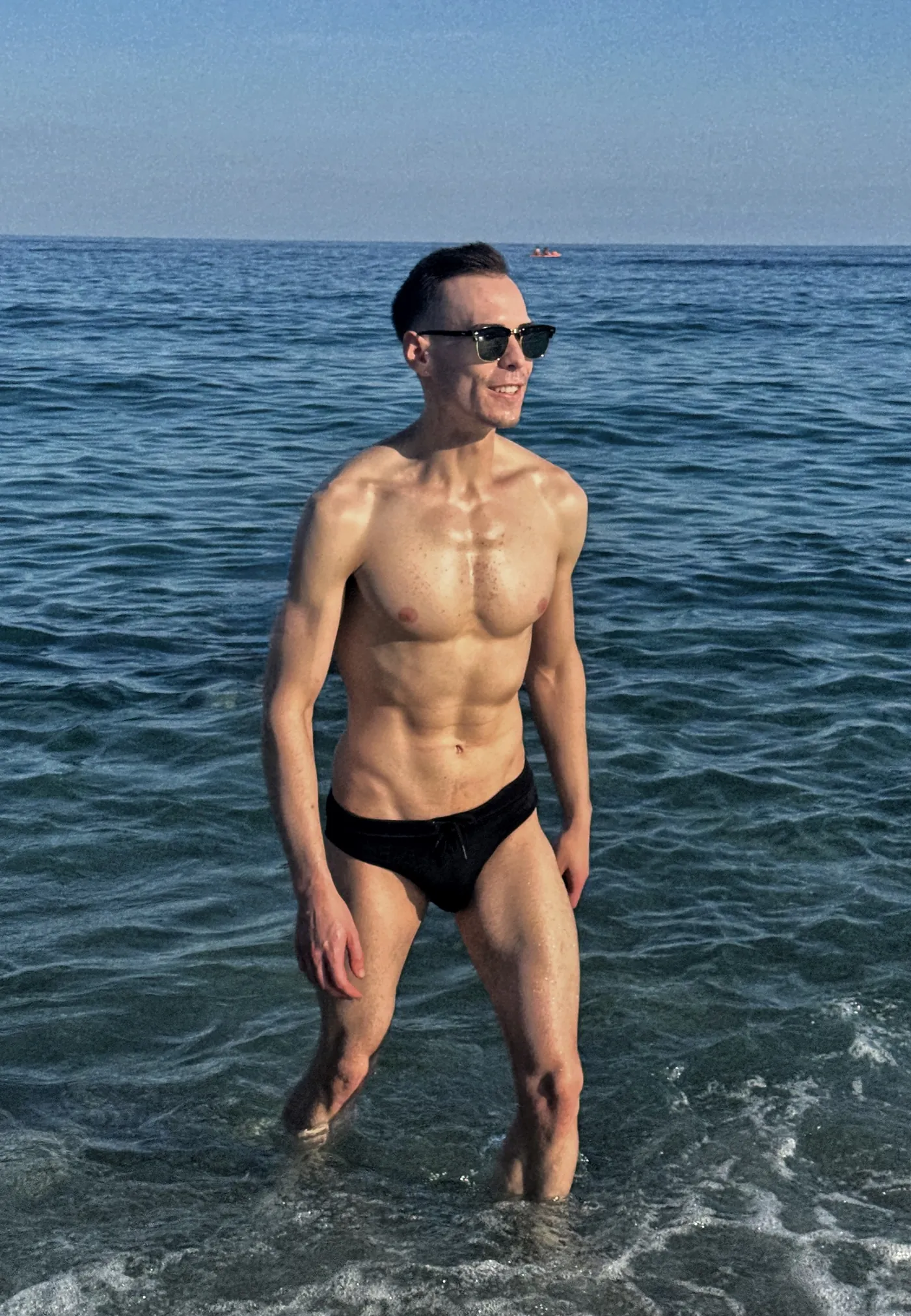István walking through the sea, athletic build on display